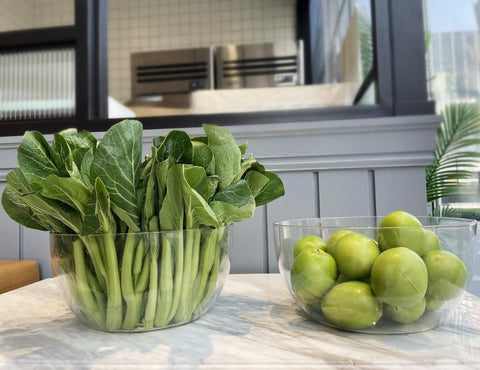 Qxbekmor two-pack clear serving bowls ideal for chips and dips at gatherings.