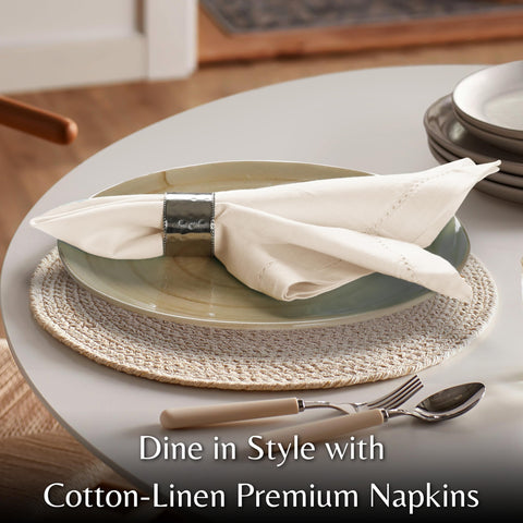 Napkins folded on table by Ramanta Home for a polished presentation.