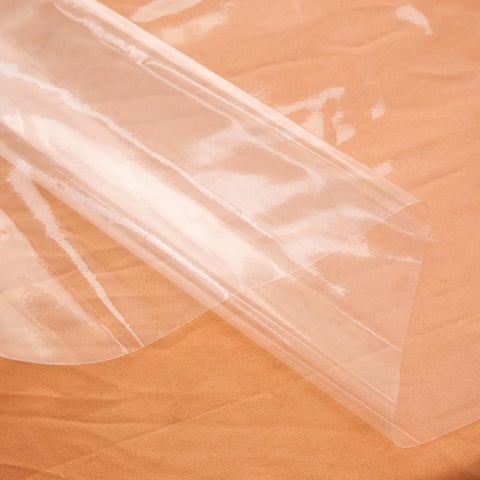 Rawgoodz clear tablecloth protector 70x70 in dining setup shows waterproof surface