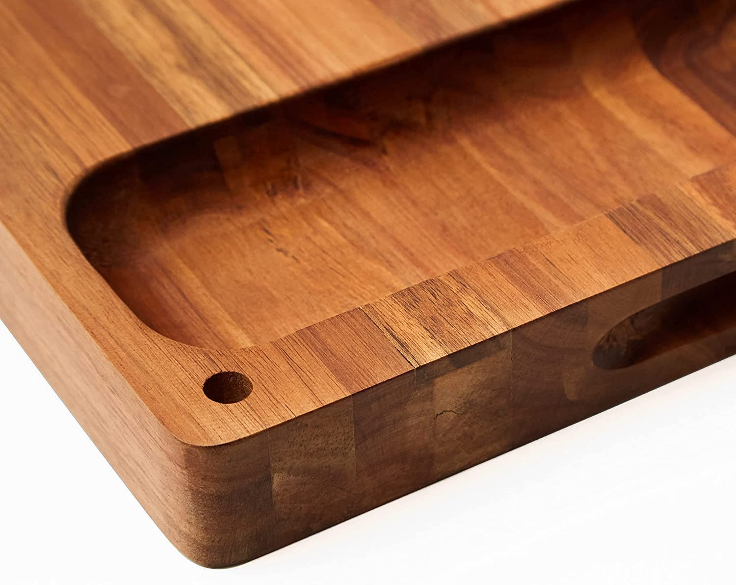 Real Life Living acacia cutting board used for dishware presentation and serving