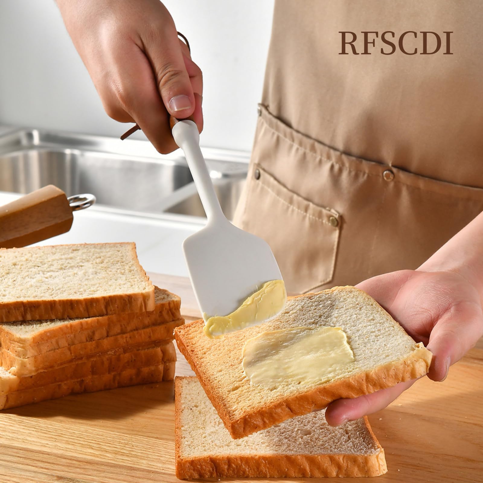 RFSCDI white silicone slotted turner supports turning delicate foods on nonstick pans.