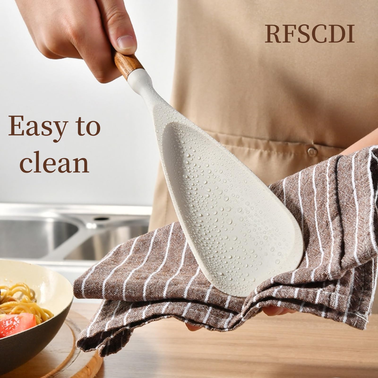 RFSCDI wood-handled utensil close-up shows ergonomic grip and heat resistance.