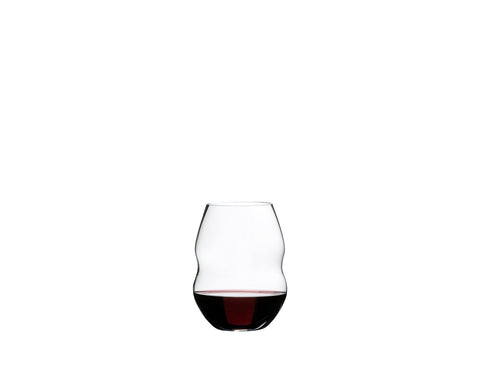 Riedel Swirl red wine glass close-up of rippled grooves guiding wine.