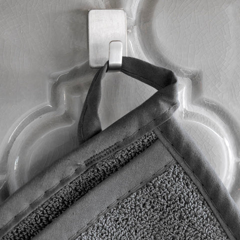 RITZ pot holder graphite with hanging loop demonstrates easy storage.