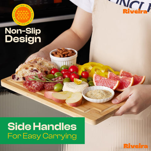 Riveira bamboo cutting board handles designed for easy transport from counter to table.