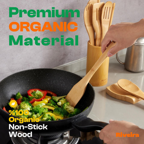 Riveira wooden spatulas and spoons on counter for flipping and stirring.