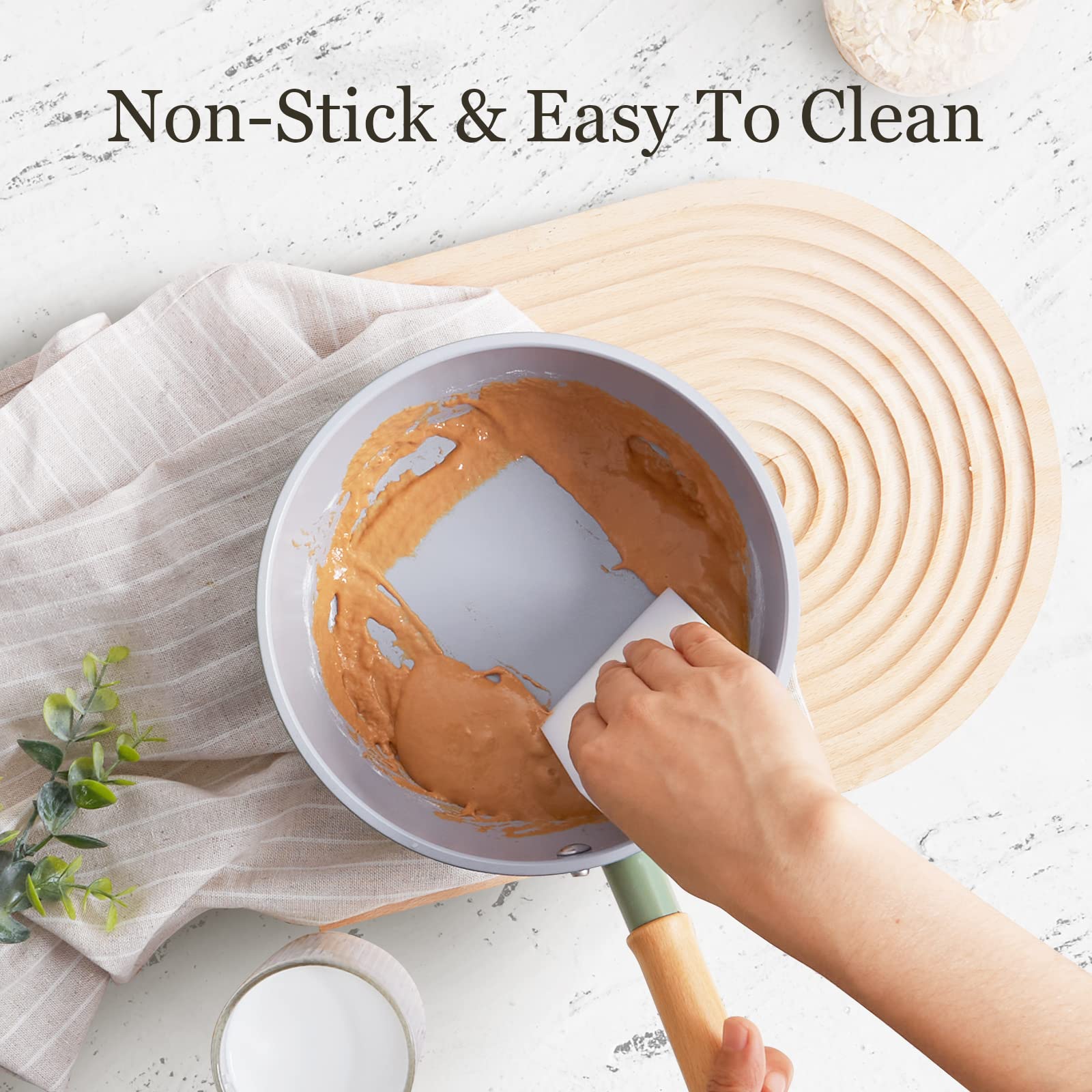 ROCKURWOK wooden-handle pan stays cool to touch during sautéing.