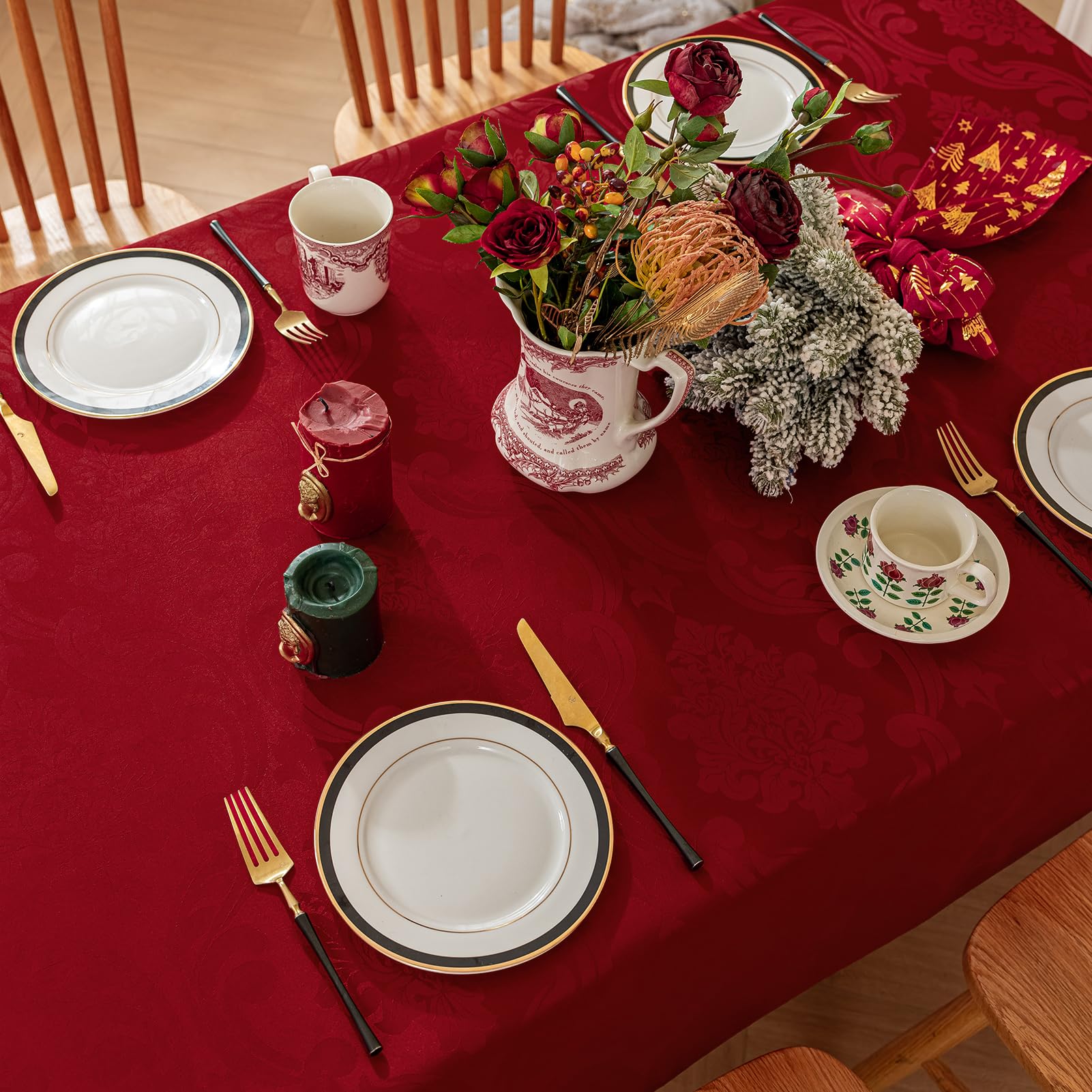 Romanstile tablecloth on holiday table showcasing red flower motif for Xmas decor.