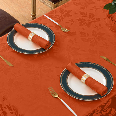 Romanstile jacquard tablecloth set for a formal dinner arrangement.