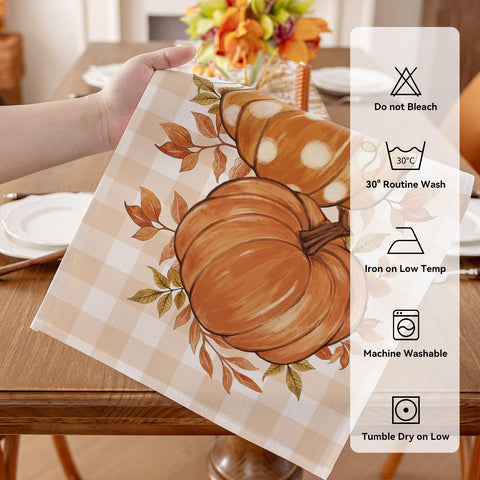 Romanstile fall dining decoration featuring pumpkins and maple leaves