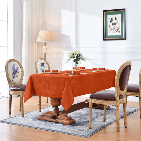 Romanstile burnt orange jacquard close-up showing woven floral texture.