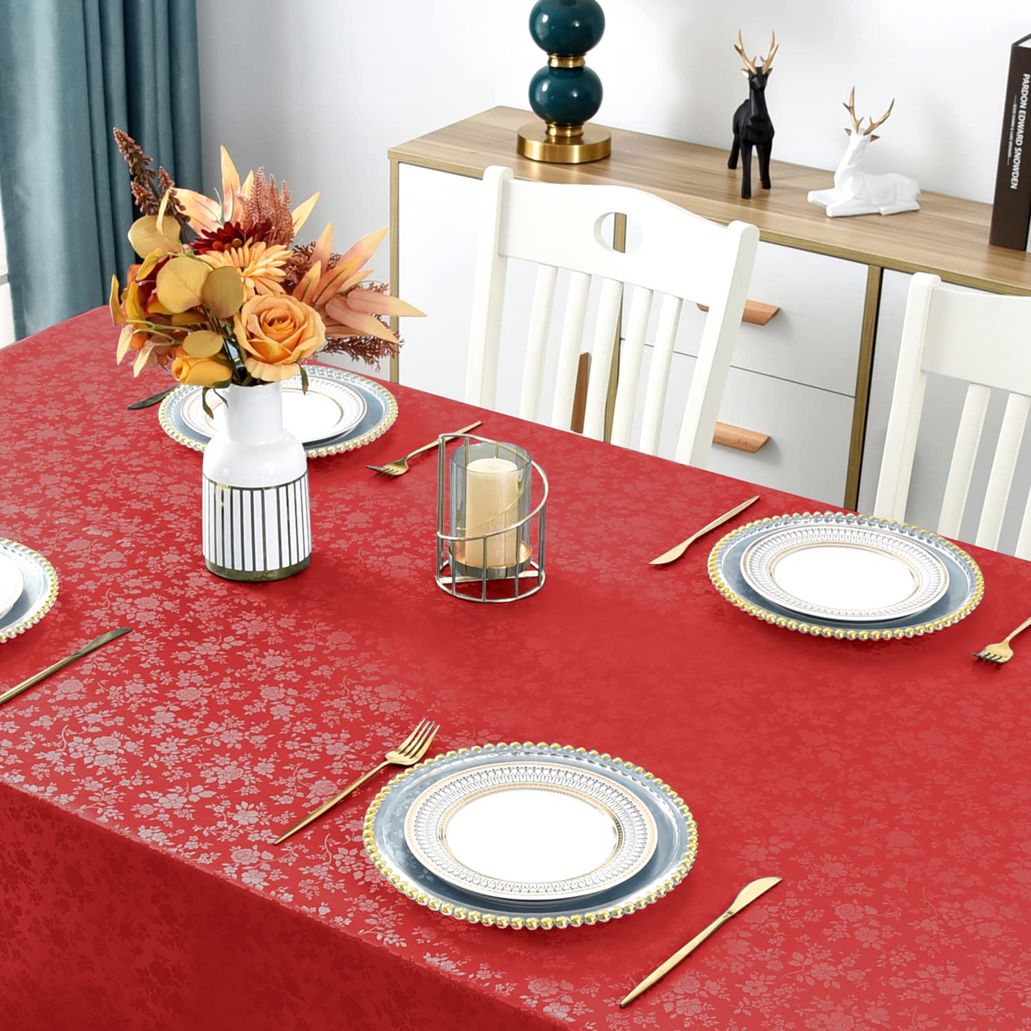 Romanstile dining room setup with rose red tablecloth for warm gatherings.