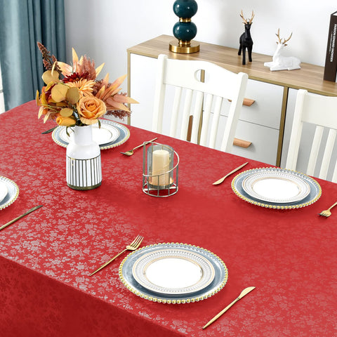 Romanstile dining room setup with rose red tablecloth for warm gatherings.