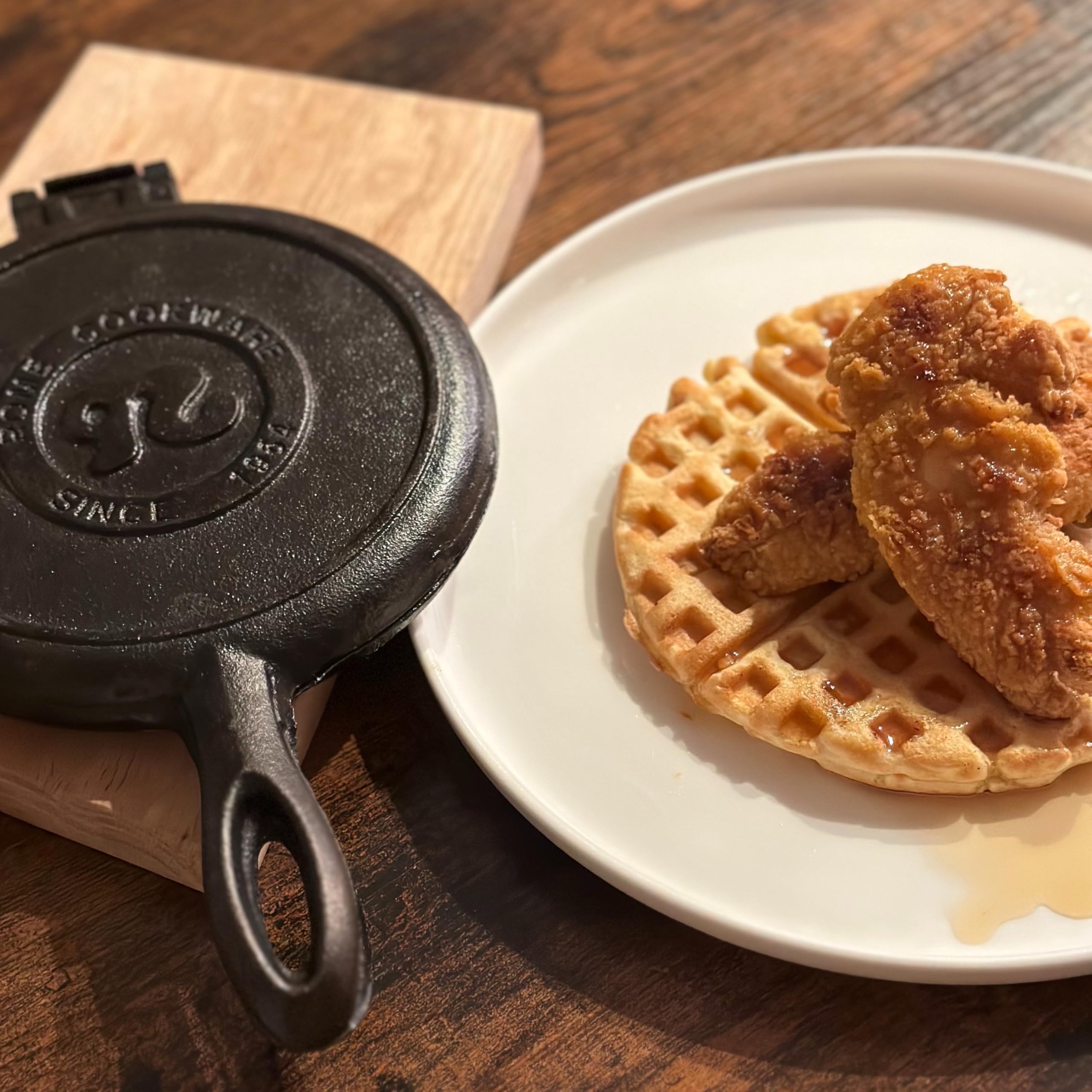 Waffle iron measures 6.75-inch round and 10 inches long