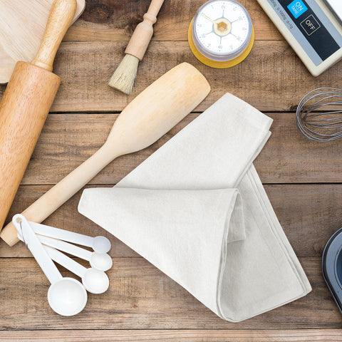 Royale Linens flour sack towel demonstrating absorbent performance for spills