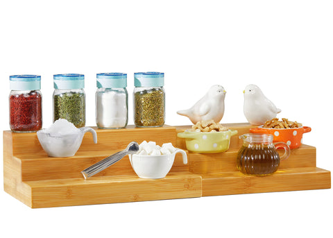 RoyalHouse Bamboo expandable spice rack with 3 tiers organizes spices in a tidy cabinet.