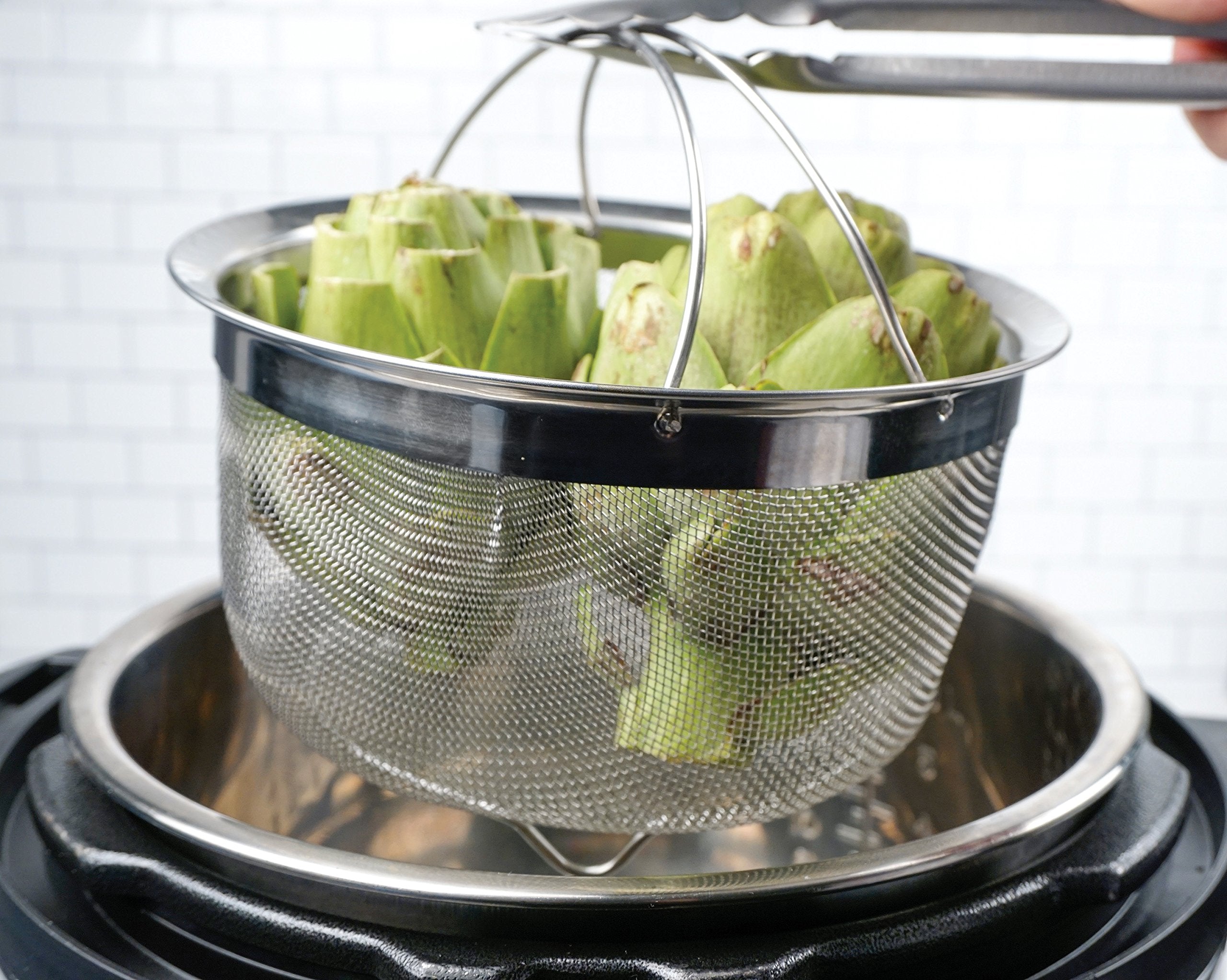 RSVP International folding handles simplify lifting when transferring hot contents from pot.