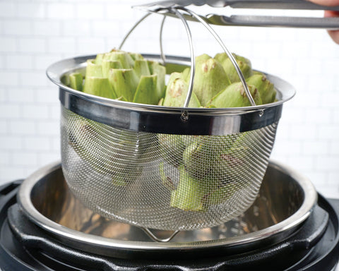 RSVP International folding handles simplify lifting when transferring hot contents from pot.