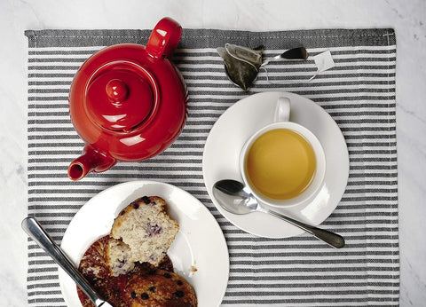 Ergonomic handle on RSVP International red teapot enables comfortable pouring.