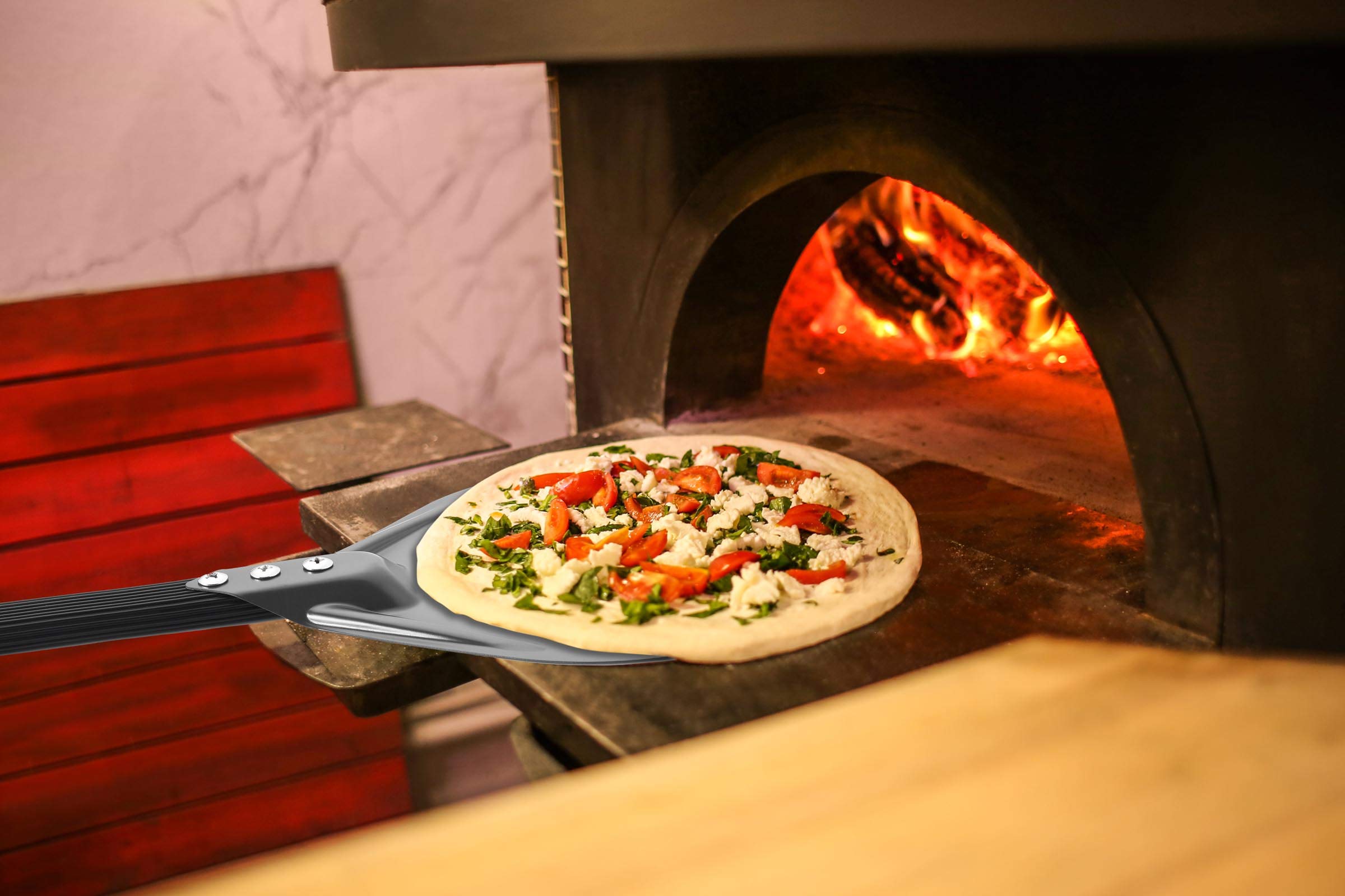 RTT non-stick anodized aluminum paddle for durability and easy lifting.