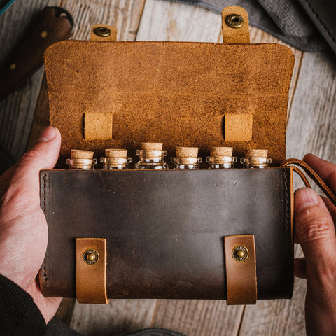 Ruck and River corked vials in leather spice wallet for easy access to flavors