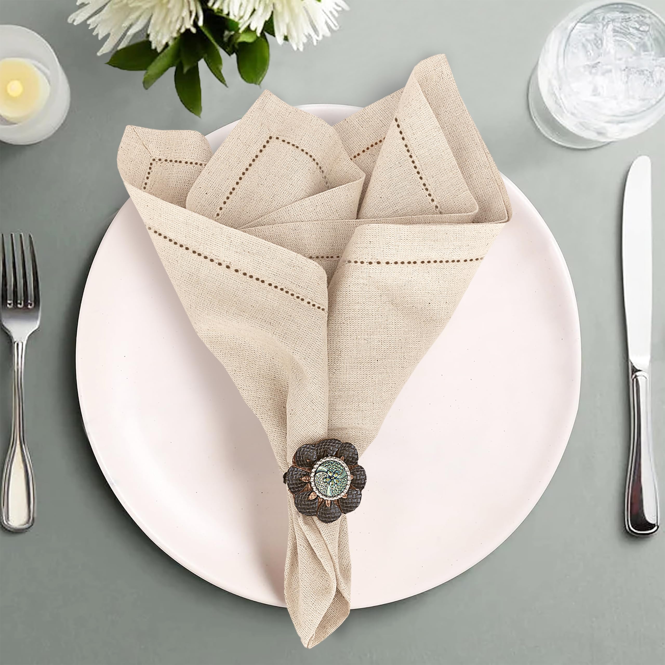 Ruvanti napkins showing mitered corners enhance formal dining ambiance