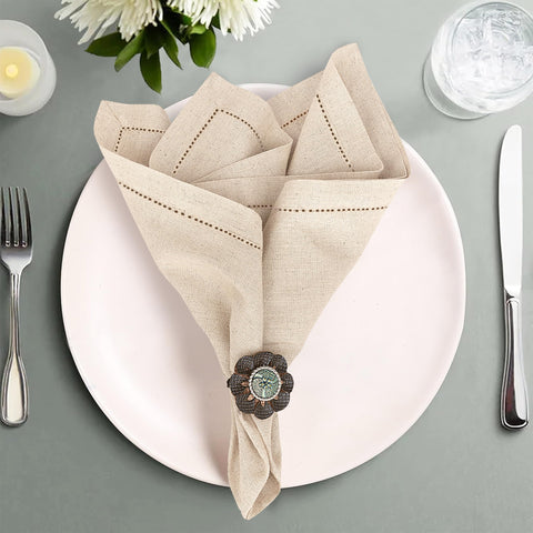 Ruvanti napkins showing mitered corners enhance formal dining ambiance