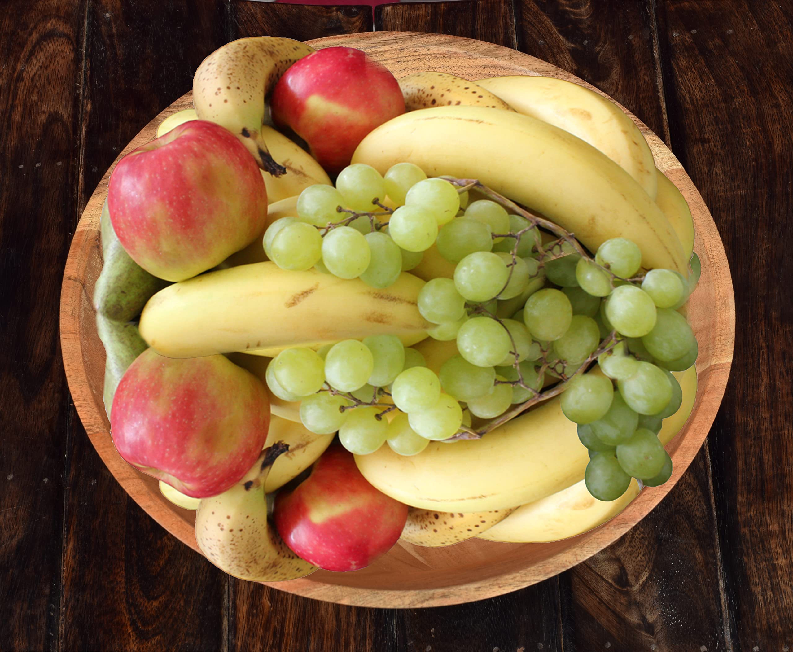 Samhita acacia wood bowl on dining table in an elegant setting
