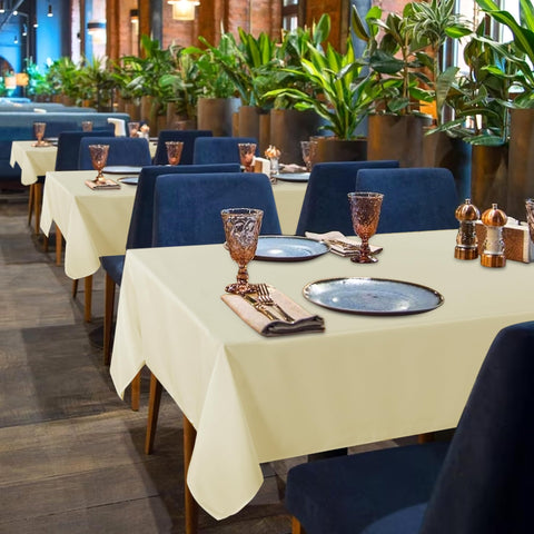 Sancua beige tablecloth set up for dining and buffet presentation.