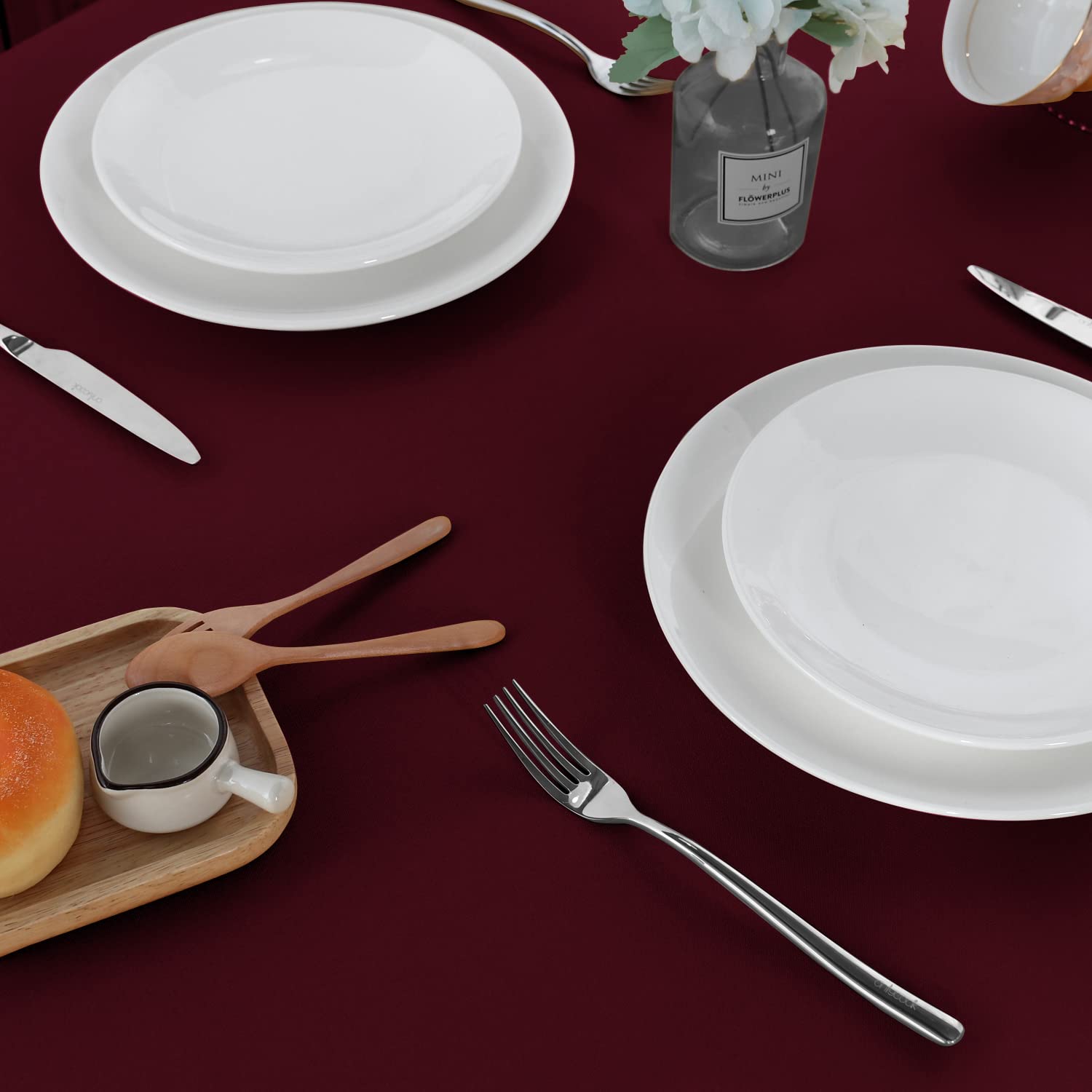 Sancua burgundy tablecloth measures 60 by 84 inches