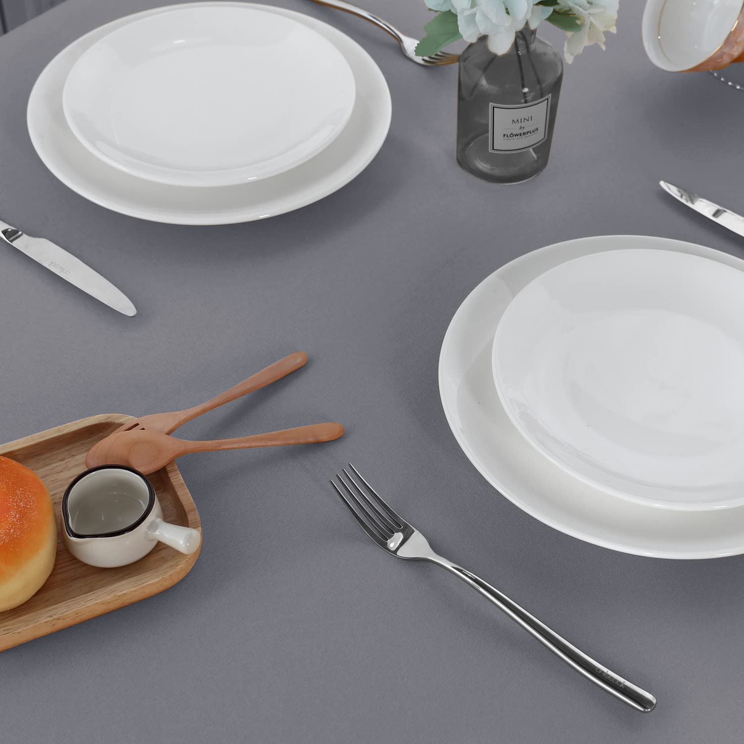 Sancua machine-washable tablecloth shown folded for quick cleaning and storage.