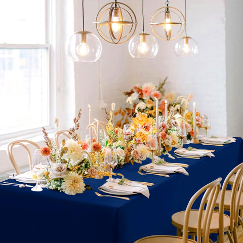 sancua navy blue tablecloth being set up for a sophisticated event setup