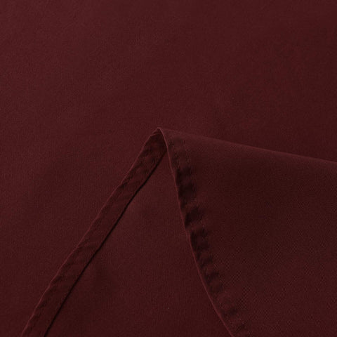 Sancua 90-inch burgundy tablecloth outdoors during party setup for weather-ready decor.