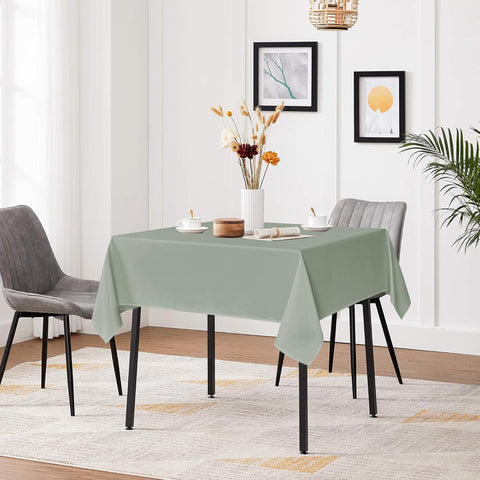 Two-pack sage green Sancua tablecloths cover multiple tables for events