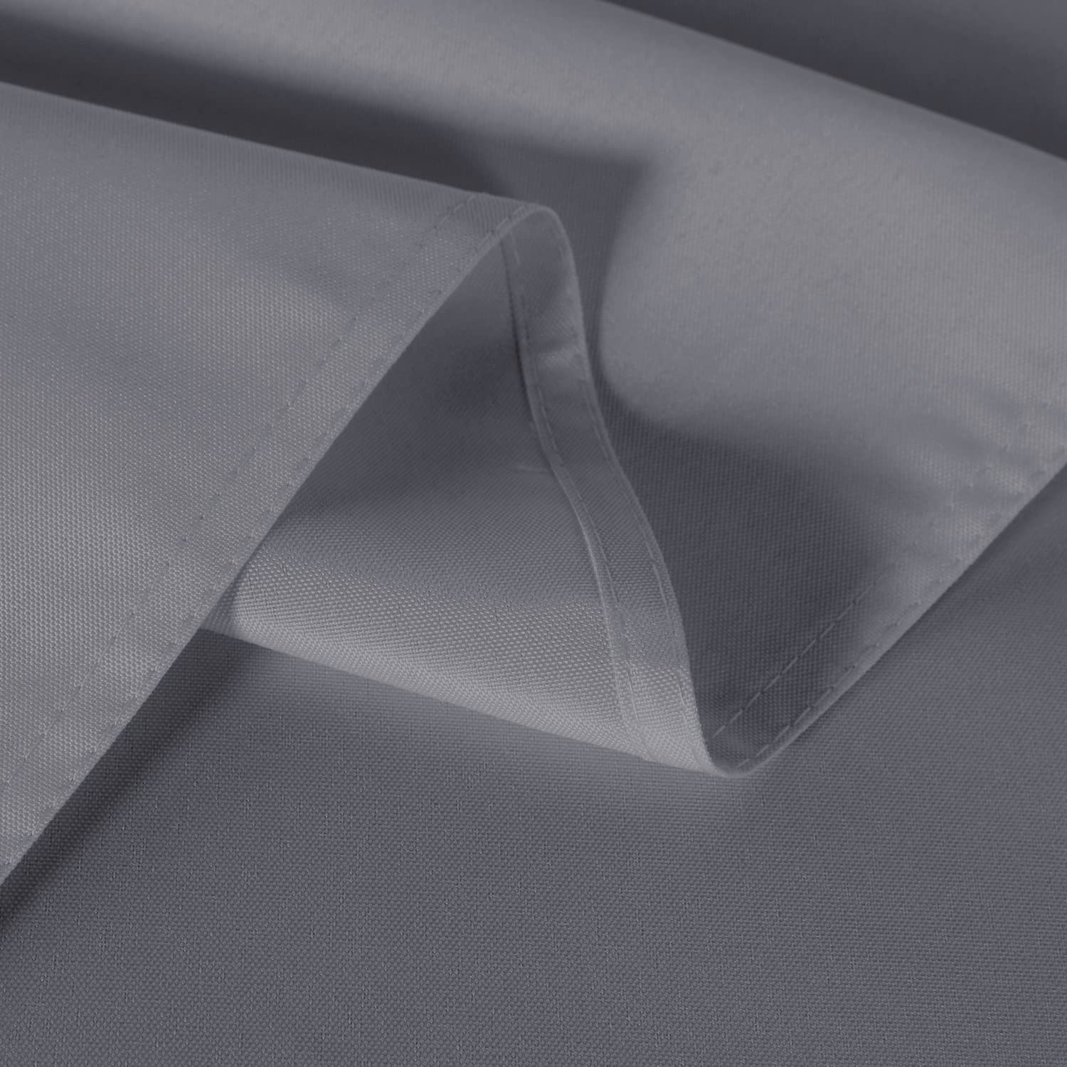 Sancua tablecloth with smooth fall on dining table, highlighting drape and shine.