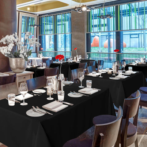 Sancua emerald 54x108 tablecloth highlights table presence for upscale gatherings.