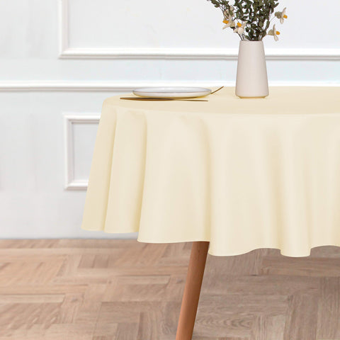 Sancua stain-resistant beige tablecloth shielding tables from spills during meals.