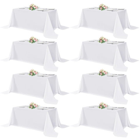 Sancua white rectangular tablecloth 90x132 inches on a 6-foot table for bulk events.