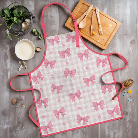 SANDJEST Bow Kid Apron during candy baking activity with pocket ready