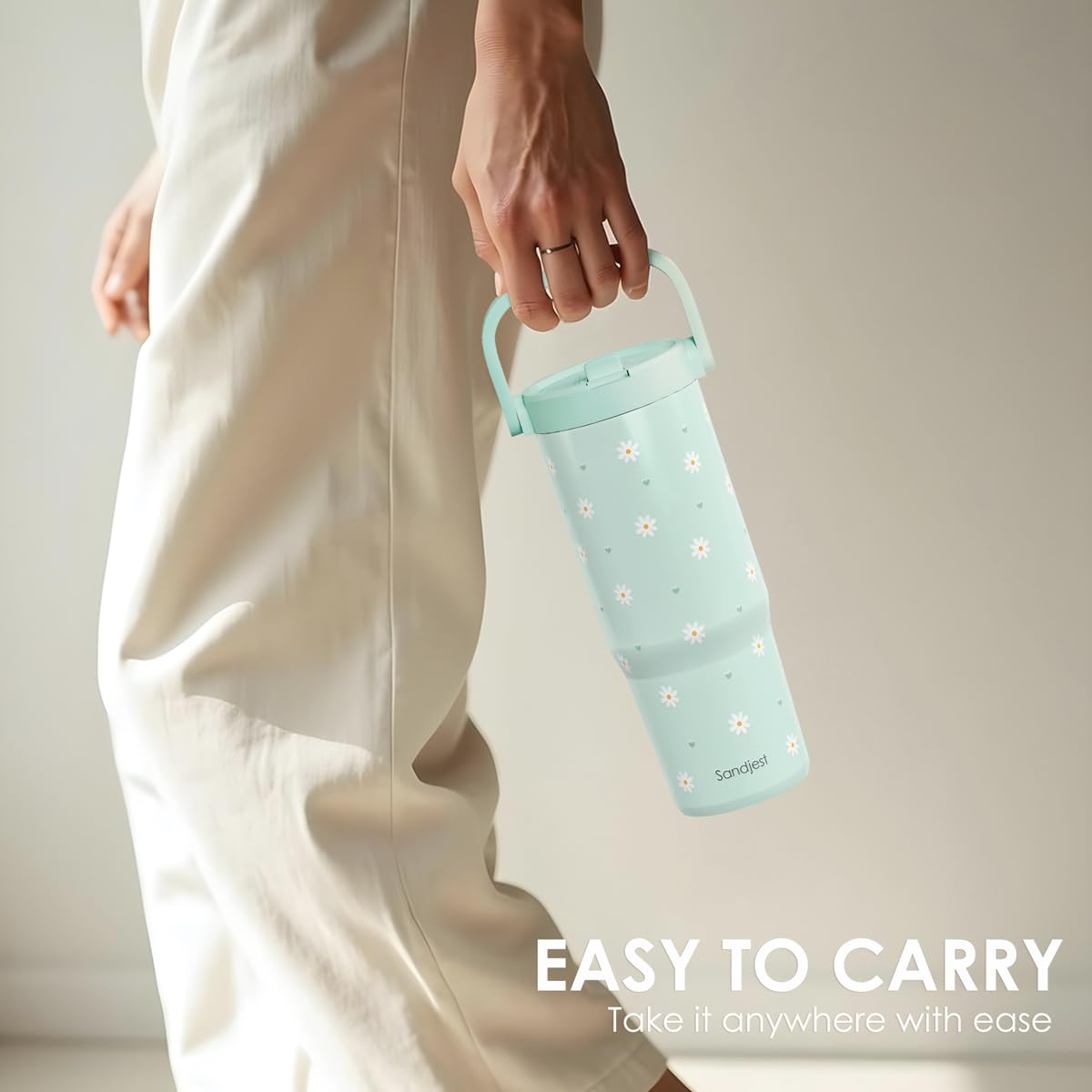 SANDJEST Daisy tumbler in use at the gym with mint finish and straw lid