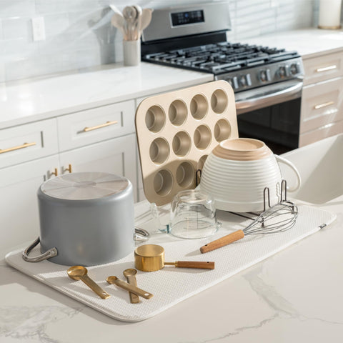 S&T INC. jumbo cream mat on counter catching drips and protecting surfaces