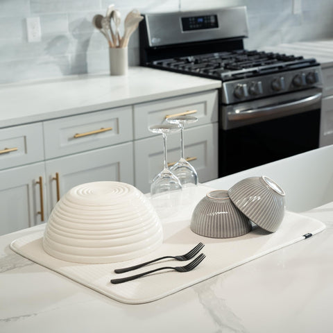 S&T INC. Dish Drying Mat XL shown under a rack catches drips and protects surfaces.