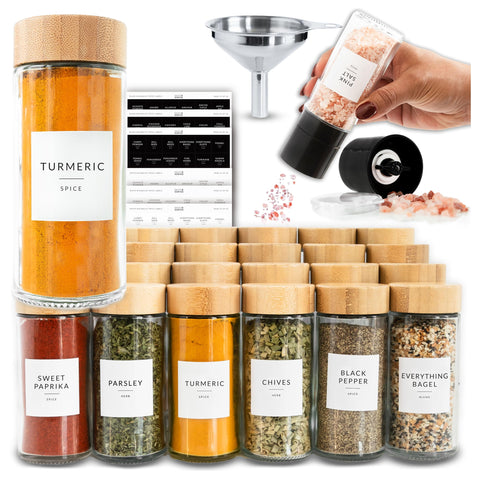 Savvy & Sorted glass spice jars with labels for organized drawer storage.