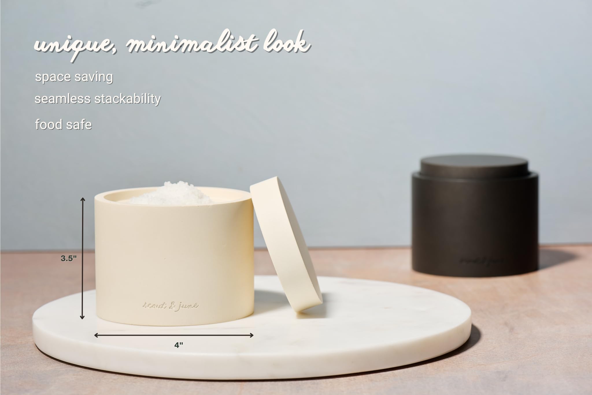 Stacked salt and pepper bowls from Scout and June on a clean kitchen counter.