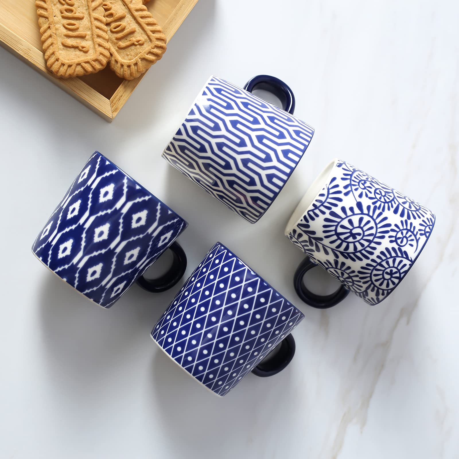Selamica espresso cups with ergonomic handles for easy pouring.