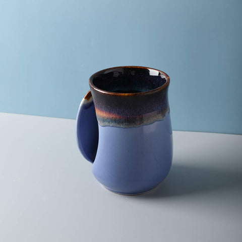 Selamica handwarmer design allows warming hands by briefly holding the mug with hot water.