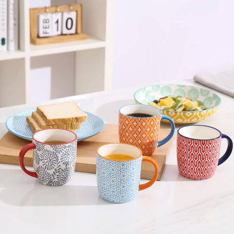 Selamica mugs on a stylish shelf display evoke gift-ready charm.
