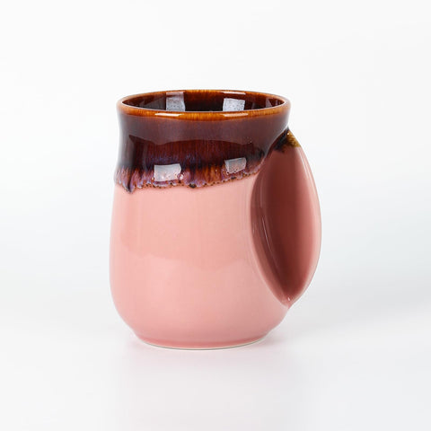 Selamica right-handed pink mug with ergonomic pocket for warming hands while sipping tea.