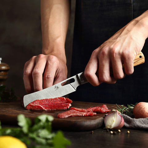 Senbon compact kitchen knife on a counter for daily tasks.