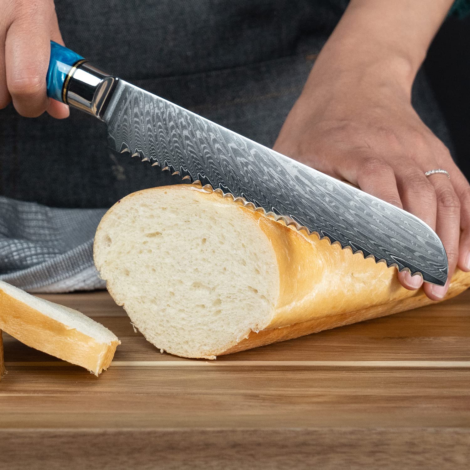 Senken Knives Tsunami blue resin handle detail highlighting grip and style.